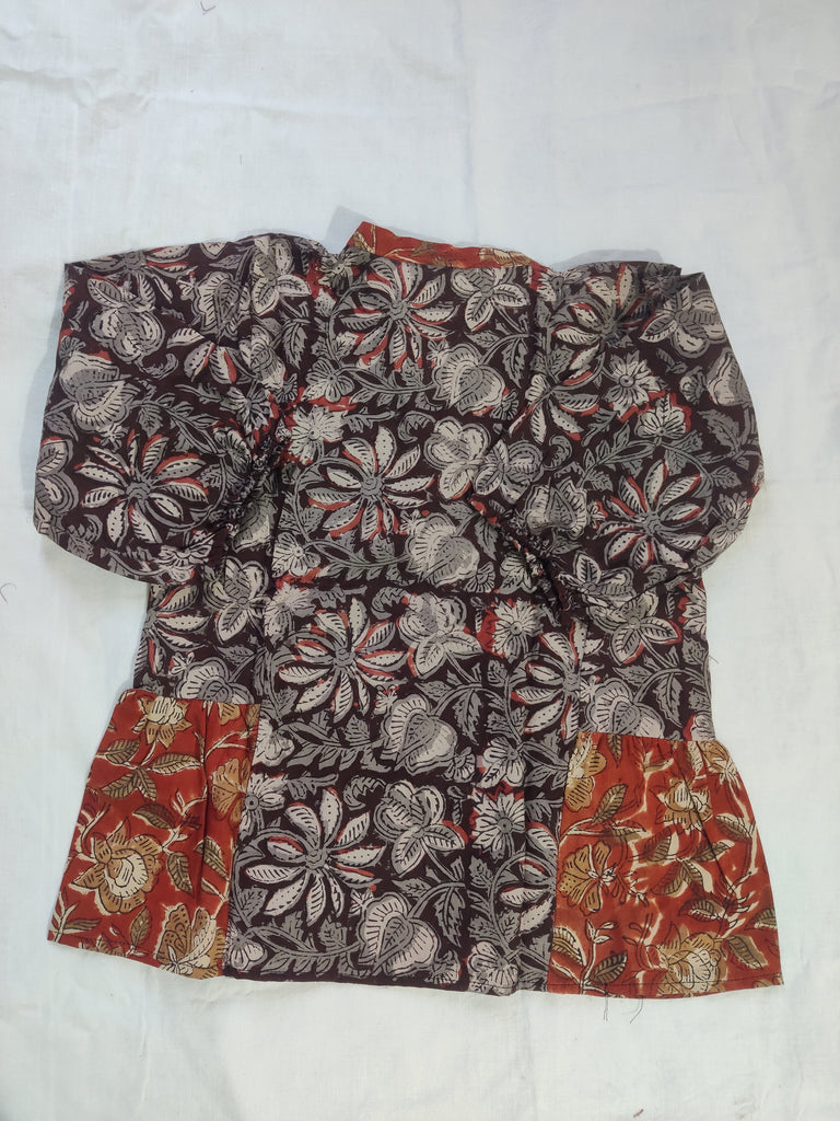 Floral patterned fabric piece on a white background