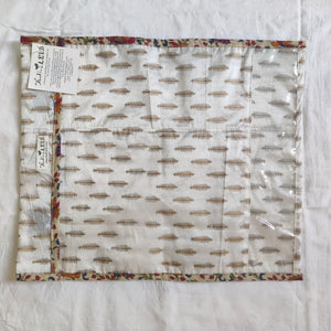 Patterned fabric with a label on a white background