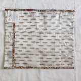 Patterned fabric with a label on a white background