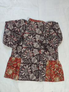 Floral patterned fabric piece on a white background